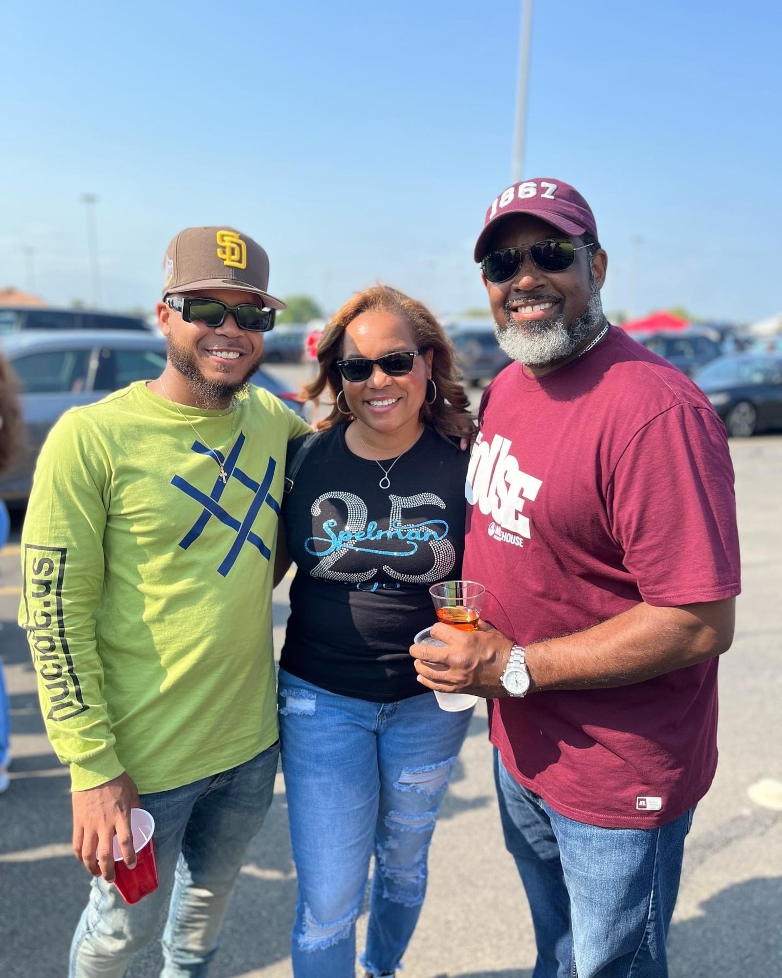 Adrienne and Lorenz Willis pose with Adrienne's son, Keno Lucas II, at Homecoming 2022. Courtesy