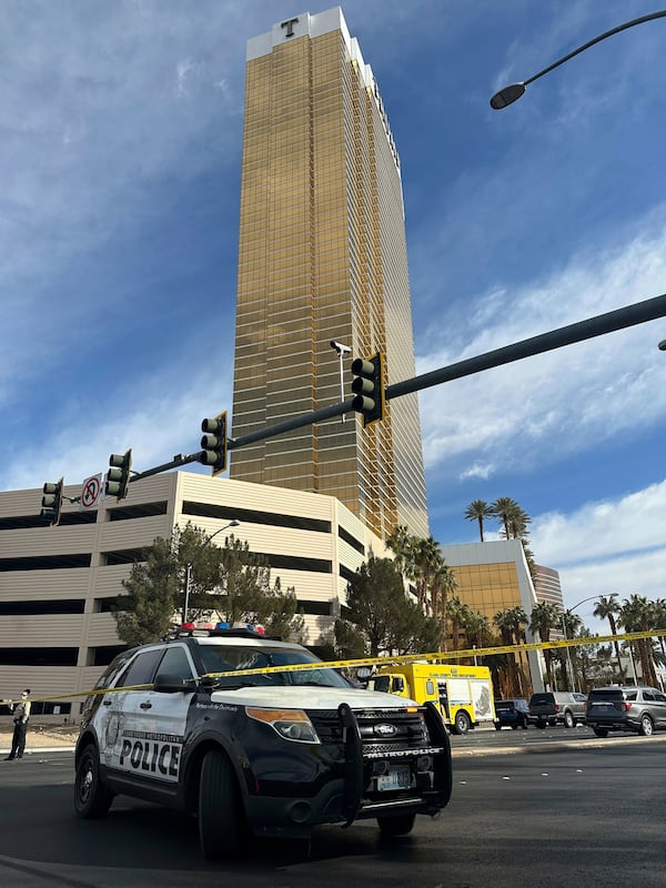 Police block the area after a vehicle caught fire and exploded outside the lobby of President-elect Donald Trump's hotel Wednesday, Jan. 1, 2025. (AP Photo/Ty ONeil)