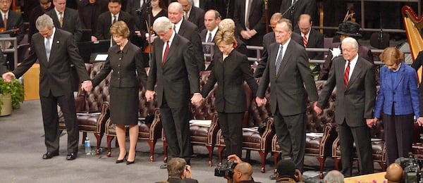 U.S. Sen. Hillary Clinton attends the funeral service for Coretta Scott King, wife of Dr. Martin Luther King, Jr., at the New Birth Missionary Baptist Church on Feb. 6, 2006. Pictures with her are President George W. Bush, First Lady Laura Bush, Bill Clinton, George H.W. Bush, Jimmy Carter and his wife, Rosalynn.