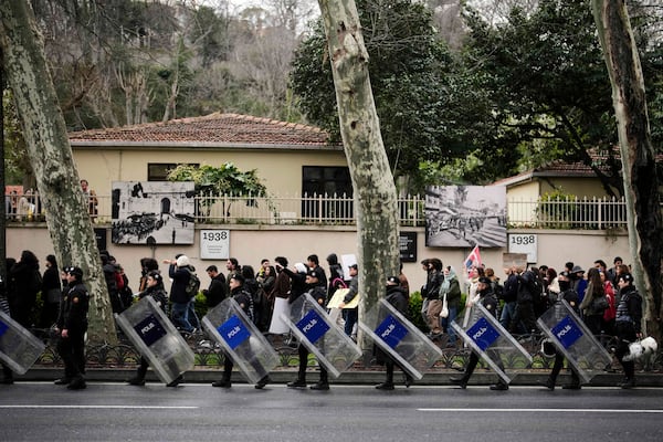 Anti riots police officers follow university students as they march to protest the arrest of Istanbul Mayor Ekrem Imamoglu, at Besiktas district in Istanbul, Turkey, Thursday, March 20, 2025. (AP Photo/Emrah Gurel)