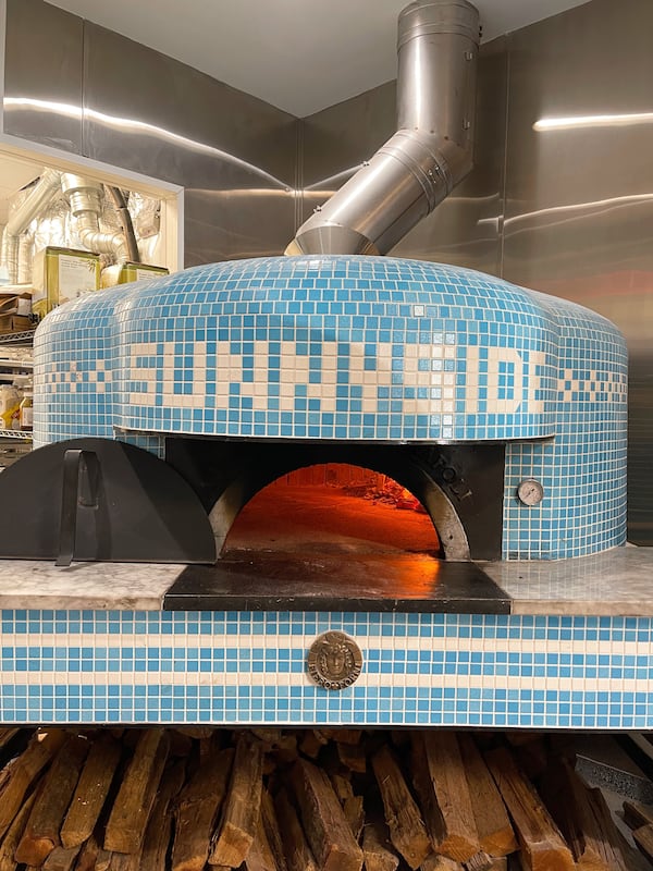 Sunnyside cooks its pizzas in a custom-made wood-fired oven. RYAN AARON PHOTO