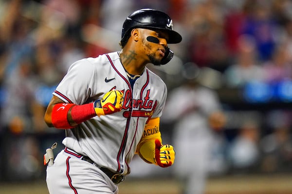 Atlanta Braves' Ronald Acuna Jr. celebrates as he runs the bases after hitting a two-run home run during the fifth inning of the team's baseball game against the New York Mets on Thursday, Aug. 4, 2022, in New York. (AP Photo/Frank Franklin II)