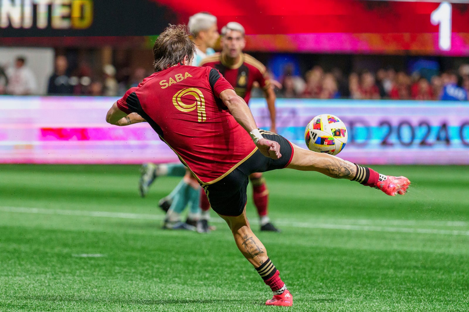 Atlanta United midfielder Saba Lobzhanidze (9) shoots on goal during the second half of an MLS soccer match against Inter Miami, Saturday, Nov. 2, 2024, in Atlanta. (AP Photo/Jason Allen)