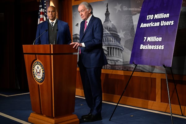 Sen. Cory Booker, D-N.J., left, and Sen. Ed Markey, D-Mass., hold a press conference to discuss Markey's bill to delay the upcoming TikTok ban deadline at the Capitol in Washington, Thursday, Jan. 16, 2025. (AP Photo/John McDonnell)