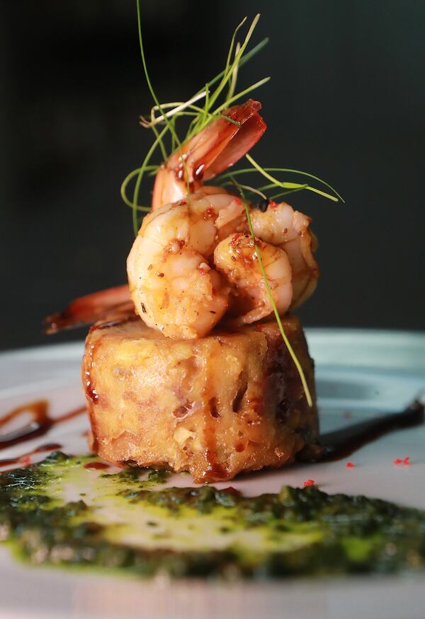 Smoky Georgia shrimp, field pea and country ham bread pudding, Almost Rum syrup, Baker Farms collard green and kale pistou by chef Deborah VanTrece, shown during a preview dinner at White Oak Kitchen & Cocktails in Atlanta, was on the menu for the June 7 Georgia Grown dinner at the James Beard House in New York. CURTIS COMPTON / CCOMPTON@AJC.COM