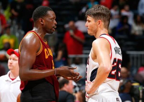 Luol Deng and Kyle Korver: Once and future teammates? (Kevin C. Cox/Getty Images)