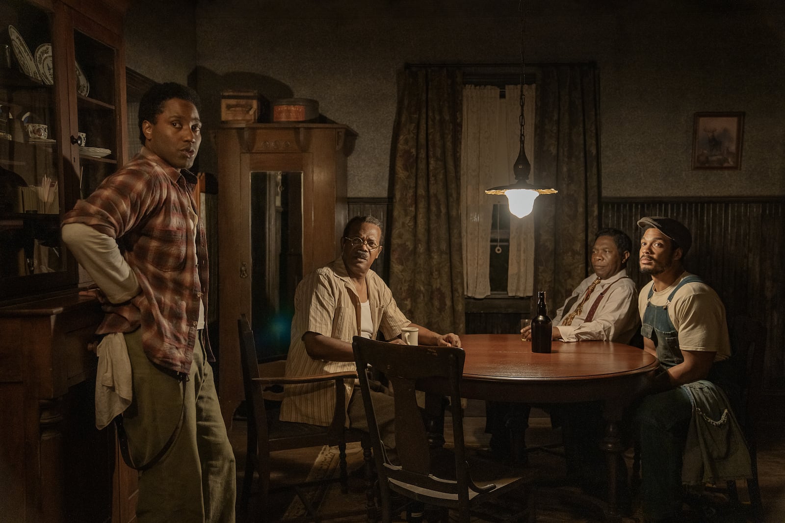 John David Washington as Boy Willie, Samuel L. Jackson as Doaker Charles, Michael Potts as Wining Boy and Ray Fisher as Lymon in "The Piano Lesson." Cr. David Lee/Netflix © 2024