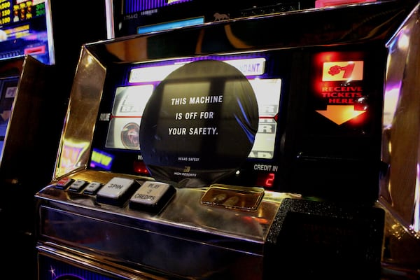 Signs remind gamblers that some machines have been disables to promote social distancing.