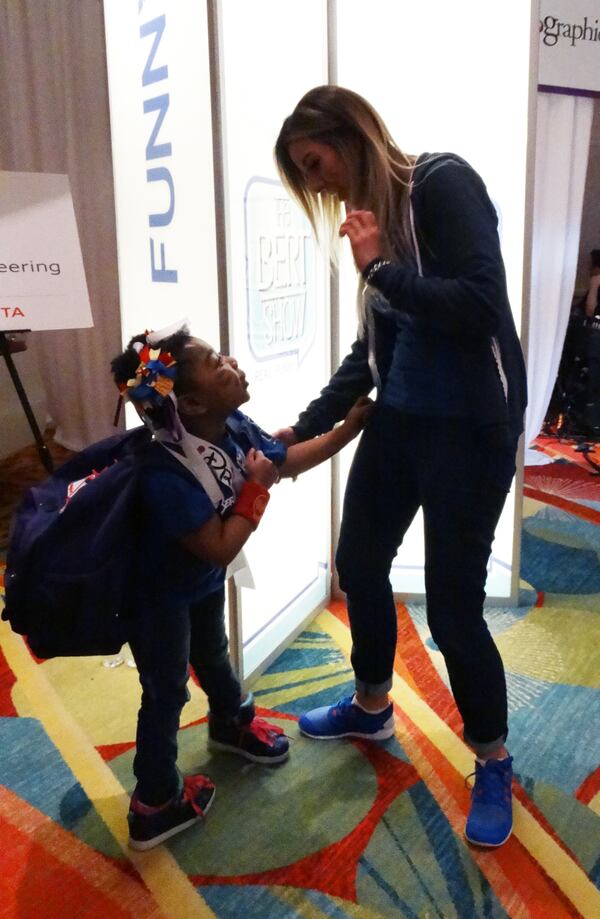 Kylin quickly became attached to Bert Show host Kristin Klingshirn. CREDIT: Rodney Ho/ rho@ajc.com