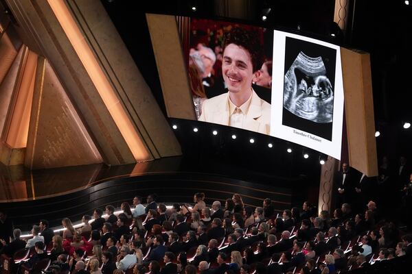 Timothée Chalamet is displayed on a screen from the audience during the Oscars on Sunday, March 2, 2025, at the Dolby Theatre in Los Angeles. (AP Photo/Chris Pizzello)