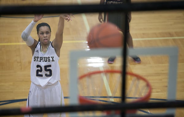 February 21, 2014 Atlanta- St. Pius player Asia Durr (25) takes a shot from the free-throw line during a High School basketball game on Friday, Feb. 21, 2014, in Atlanta, Ga. St. Pius defeated North Oconee 52-49 in the first round of the high school state tournament. BRANDEN CAMP/SPECIAL St. Pius player Asia Durr (25) takes a shot from the free-throw line. (Branden Camp / Special to AJC)