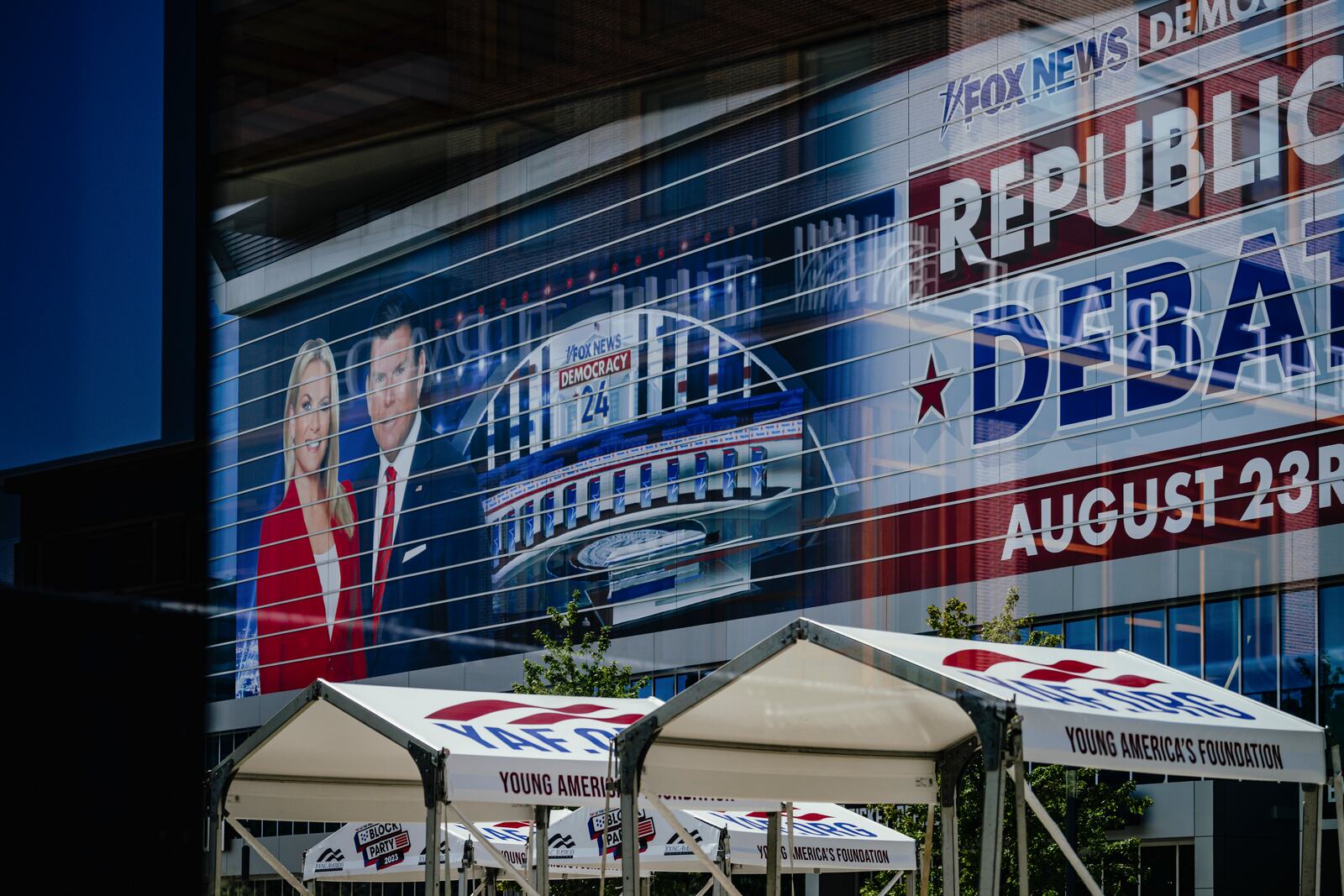 An advertisement on the side of the Fiserv Forum, where the first Republican presidential debate hosted by Fox News will be held, in Milwaukee, Wis, Aug. 22, 2023. (Jamie Kelter Davis/The New York Times)