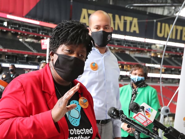 032421 Atlanta: — MASS TEACHER VACCINATION — APS Superintendent Dr. Lisa Herring delivers her remarks during the APS mass teacher vaccination featuring approximately 1,200 Atlanta Public Schools (APS) teachers and staff members receiving the first of two shots of the Pfizer vaccine against COVID-19 at Mercedes-Benz Stadium on Wednesday, March 24, 2021, in Atlanta.  “Curtis Compton / Curtis.Compton@ajc.com”