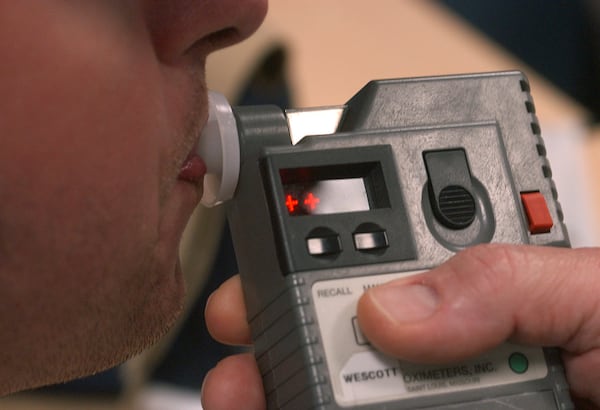 Officers are trained in the use of Breathalyzers for roadside sobriety tests. (BOB ANDRES/AJC staff)