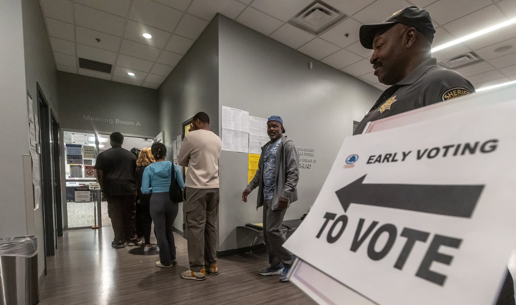 Voters enter the polls at the Buckhead Library  in Atlanta on Friday, Nov. 1, 2024, on the last day of early voting in Georgia. (John Spink/AJC)