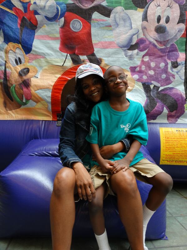 Nachelle Pitts and her son Jaryn are enjoying a weekend at Disney World as I type this. Jeryn is recuperating from a stroke. CREDIT: Rodney Ho/rho@ajc.com