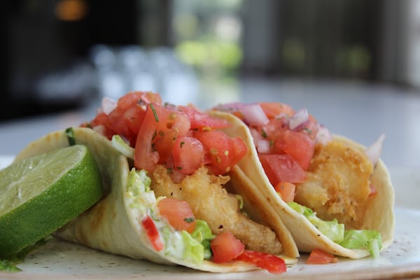 Take a bite out of fish tacos, which are two for $5 at Savor Bar & Kitchen today. Photo credit: M-Squared Public Relations.