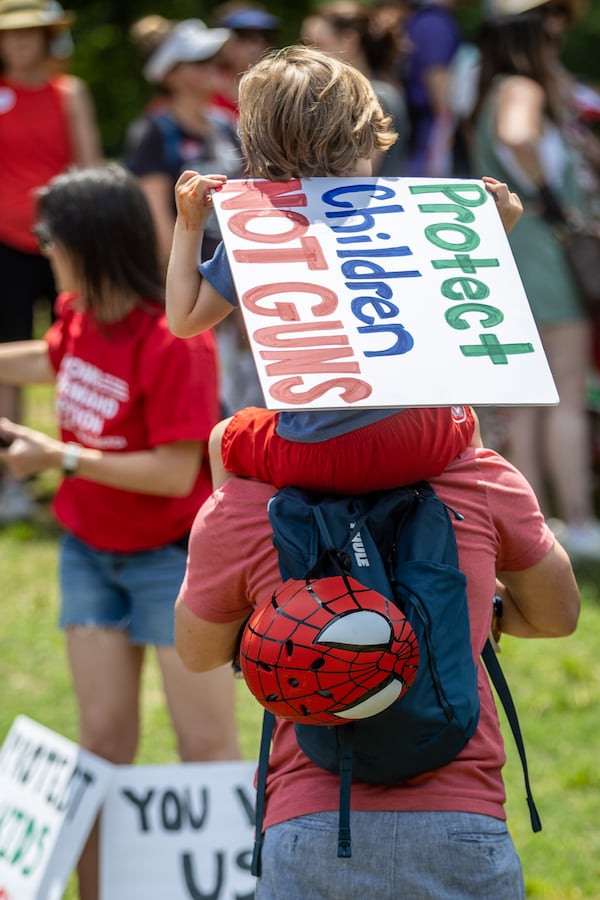 People gather in Piedmont Park before a rally organized by Georgia Moms Demand Action on Saturday, May 13, 2023. The rally was part of a national series of protests the day before Mother’s Day to highlight the mounting toll of gun violence.  (Steve Schaefer/steve.schaefer@ajc.com)