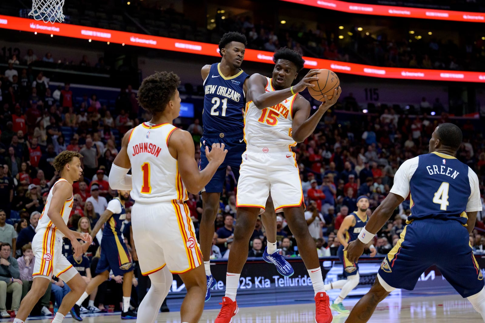 Atlanta Hawks center Clint Capela (15) grabs a rebound against New Orleans Pelicans center Yves Missi (21) during the first half of an NBA basketball game in New Orleans, Sunday, Nov. 3, 2024. (AP Photo/Matthew Hinton)