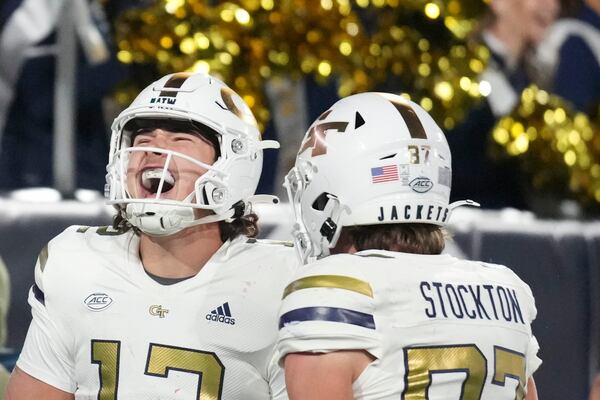 Georgia Tech quarterback Aaron Philo (12) celebrates a touchdown during the second half of an NCAA college football game against North Carolina State, Thursday, Nov. 21, 2024, in Atlanta. (AP Photo/Brynn Anderson)