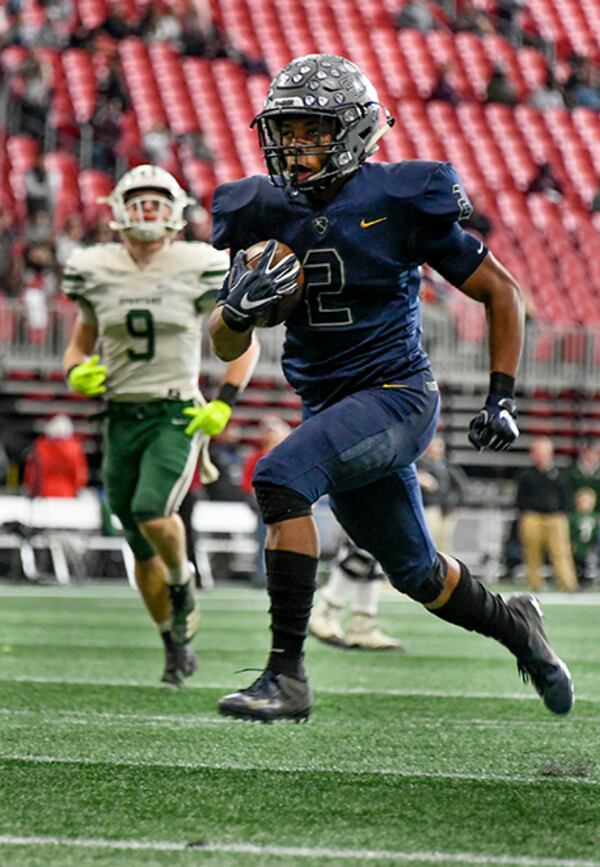 Eagle's Landing Christian Academy running back Keaton Mitchell rushes for a touchdown past Athens Academy linebacker Kurt Knisely (9) during a class A Private high school championship Dec. 12, 2018, at Mercedes-Benz Stadium in Atlanta. ELCA won 44-17.