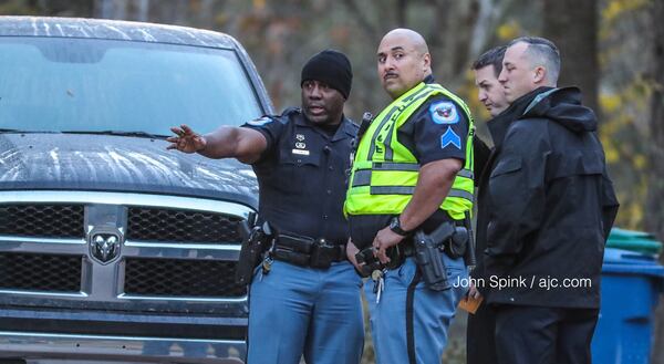 Cobb County officers respond to a shooting on Buckland Way in Mableton on Monday morning. JOHN SPINK / JSPINK@AJC.COM