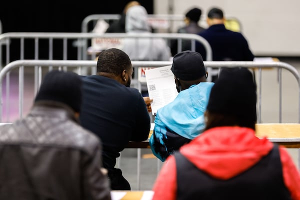 Fulton County Registration and Elections employees conduct an audit of paper ballots for the Georgia secretary of state race in College Park on Thursday, November 17, 2022. (Arvin Temkar/The Atlanta Journal-Constitution)