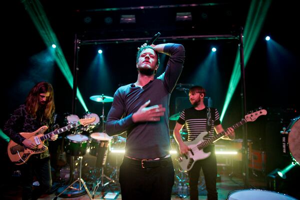 February 25, 2015 Atlanta - Imagine Dragons' Dan Reynolds (center), Wayne Sermon (left) and Ben McKee perform on stage at Terminal West in Atlanta to a sold out show on Wednesday, February 25, 2015. JONATHAN PHILLIPS / SPECIAL Dan Reynolds was engaging in the cozy confines of Terminal West. Photo: Jonathan Phillips/Special to the AJC.