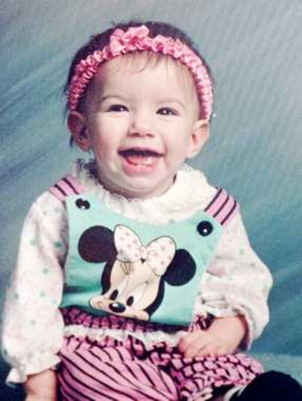 Baylee Almon, the year-old infant whose picture became a symbol of the horrific bomb attack that left the Alfred P. Murrah Federal Building in downtown Oklahoma City in rubble, is shown at 10 months in this family portrait. 