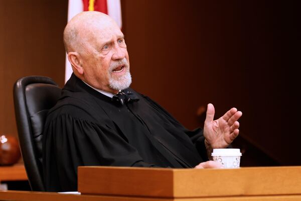 Judge Jerry Baxter answered questions from attorney Stephen Scarborough during a hearing where he presented a motion requesting to withdraw from representing the last six remaining defendants from the APS scandal case on his belief it's a conflict of interest. (Miguel Martinez/miguel.martinezjimenez@ajc.com.)