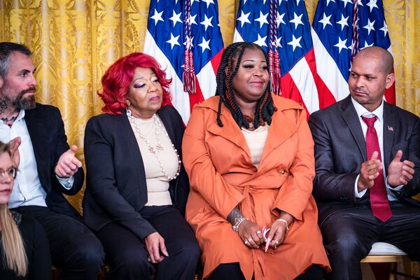 
                        FILE — From left, the election workers from Georgia, Ruby Freeman and her daughter, Shaye Moss, acknowledged by President Joe Biden during an event commemorating the second anniversary of the attack on the U.S. Capitol, in the East Room of the White House in Washington on Jan. 6, 2023. Freeman, one of two Georgia election workers found to have been defamed by Rudy Giuliani, testified at the trial held to set the damages he will have to pay. (Pete Marovich/The New York Times)
                      