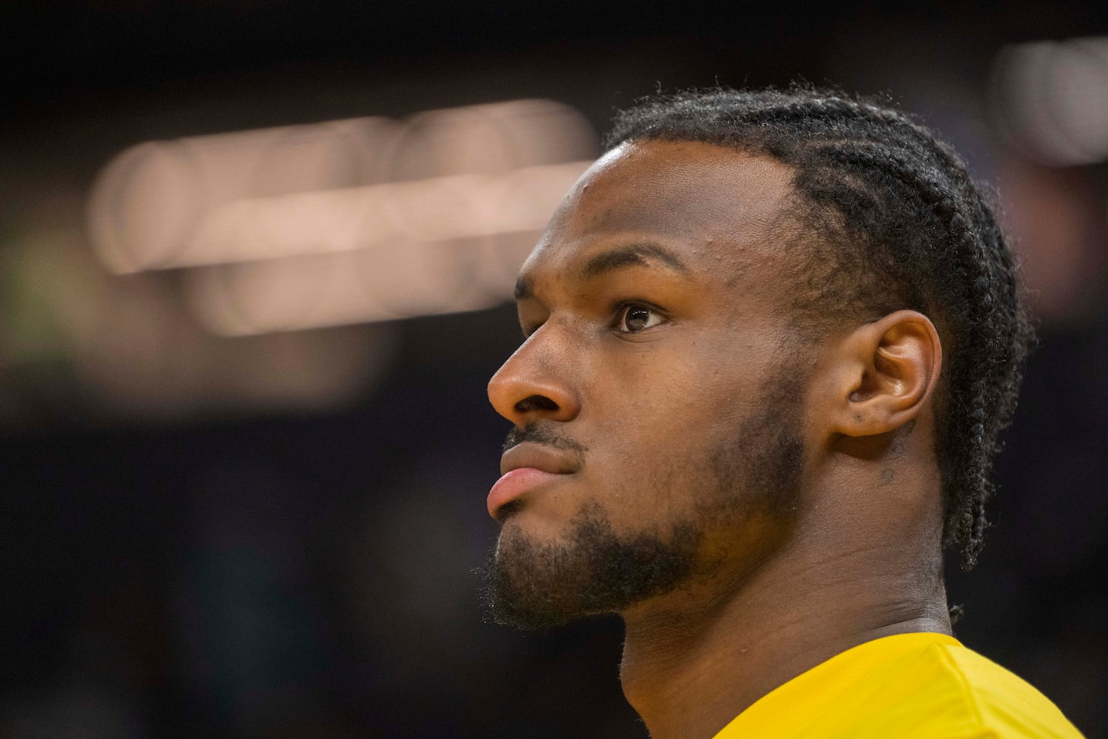 FILE - Los Angeles Lakers guard Bronny James watches warmups before an NBA summer league basketball game against the Golden State Warriors in San Francisco , Sunday, July 7, 2024. (AP Photo/Nic Coury, File)