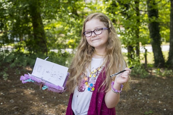 FILE: Alaya Horne poses for a photo with her diary in her Johns Creek neighborhood. ALYSSA POINTER / ALYSSA.POINTER@AJC.COM