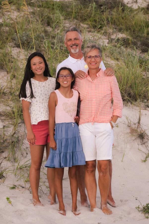 Andrea Sisler and her husband, Kent, with two of their four children, Pearl and Emma Lael. Courtesy of Andrea Sisler