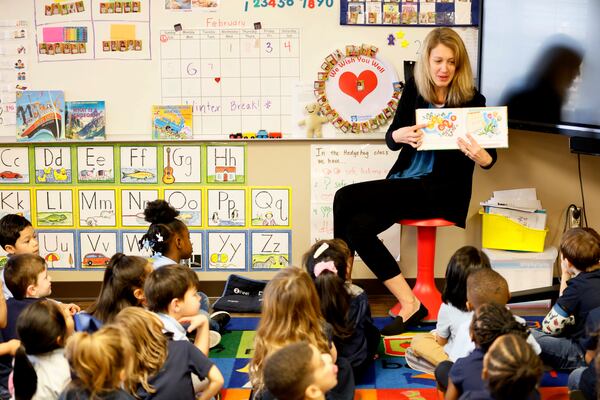 Tricia Fox reads "The Little Engine That Could" to her pre-K students at Marietta's Emily Lemback Early Learning Center. (Miguel Martinez / miguel.martinezjimenez@ajc.com)