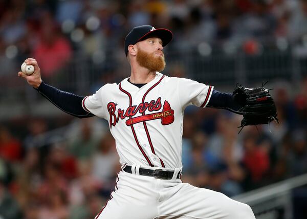 Braves pitcher Mike Foltynewicz throws a pitch in the first inning of Monday night’s 11-inning win against the Reds. (AP photo/John Bazemore)