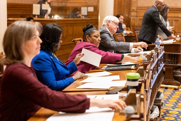 State senators take roll call iat the Capitol in Atlanta on Monday, the first day of the legislative session. (Arvin Temkar / arvin.temkar@ajc.com)