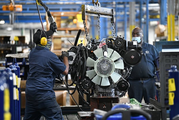 Workers assemble a school bus at a Blue Bird manufacturing facility in Fort Valley on Tuesday, May 4, 2021. (Hyosub Shin / Hyosub.Shin@ajc.com)