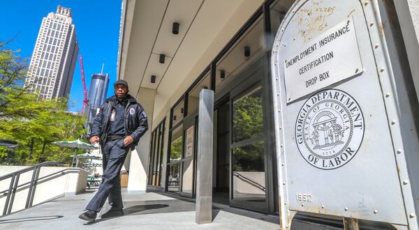 April 2, 2020 Atlanta: A security guard at the Georgia Department of Labor at 223 Courtland St NE in Atlanta walks past the unemployment certification drop box in front of the office on Thursday, April 2, 2020. Unemployment claims have skyrocketed since the COVID-19 pandemic has shut down businesses across the state and country. Georgiaâs coronavirus cases surpassed 5,000 Thursday, and the number of deaths across the state continue to grow. The latest data from the Georgia Department of Public Health shows 5,348 confirmed cases, an increase of about 13% from the 4,748 cases reported Wednesday night. Nine more Georgians have died as a result of COVID-19, the disease caused by the novel coronavirus, bringing the stateâs death toll to 163. Wednesday night. Of all that have tested positive since the outbreak began, 1,056 are hospitalized Thursday, according to the health department.  Amid predictions of a steep increase in cases and with plans in place to increase daily testing capacity, officials say those numbers could balloon in the coming weeks. Scientific projections suggest the state will see thousands of new cases and hundreds of additional deaths before the virus is contained. JOHN SPINK/JSPINK@AJC.COM