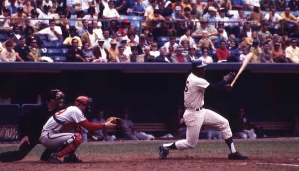 Rico Carty lashes a base hit in 1970. AJC file photo