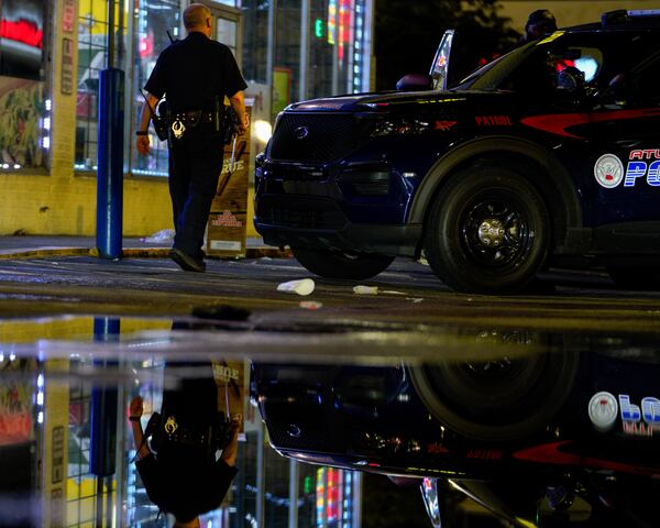 An Atlanta police officer responds to a shooting call in the 2400 block of Martin Luther King Jr. Drive. 