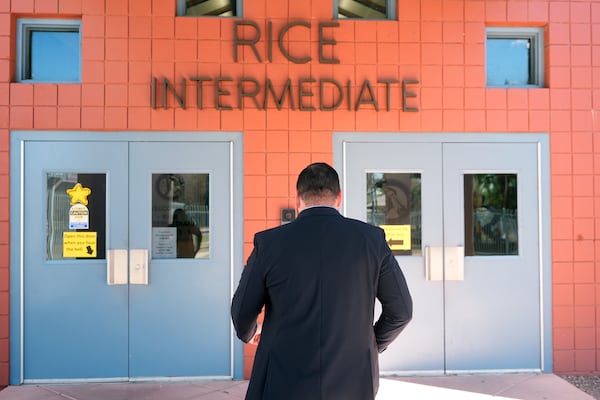 Rice Intermediate School Principal Nicholas Ferro walks to the main building on campus Tuesday, Aug. 27, 2024, in San Carlos, Ariz. (AP Photo/Ross D. Franklin)