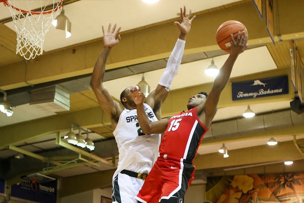 Sahvir Wheeler of the Georgia Bulldogs shoots over Xavier Tillman of Michigan State. (Photo by Darryl Oumi/Getty Images)