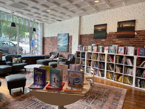 Cushioned window seats and wooden benches inside Virginia Highland Books encourage lounging. Courtesy of Beth Ward