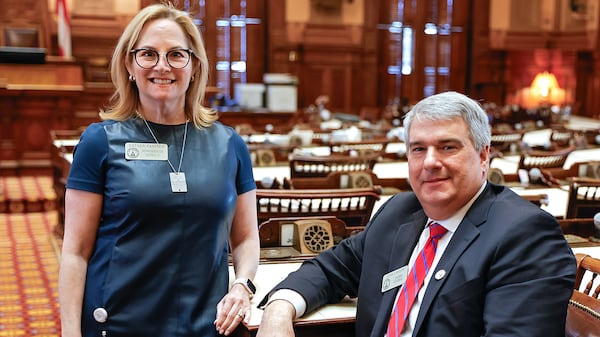 Rep. Esther Panitch, D-Sandy Springs, and Rep. John Carson, R-Marietta, on Jan. 29 in the House chambers at the Georgia State Capitol in Atlanta. (Natrice Miller/Natrice.miller@ajc.com)