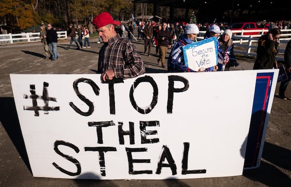 Conservative activist Matt Stout attended a rally Wednesday in Alpharetta where speakers urged the people there to skip voting in the Jan. 5 runoffs for the U.S. Senate. But he's confident “everyone will vote despite the conflicting messages.” Ben Gray for the Atlanta Journal-Constitution