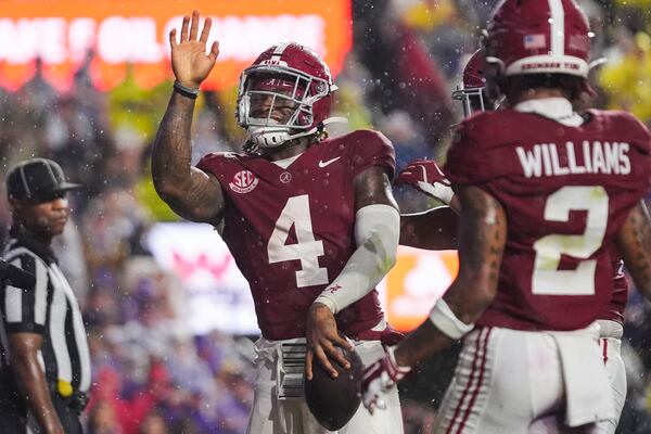 Alabama quarterback Jalen Milroe (4) celebrates his touchdown carry in the first half an NCAA college football game against LSU in Baton Rouge, La., Saturday, Nov. 9, 2024. (AP Photo/Gerald Herbert)