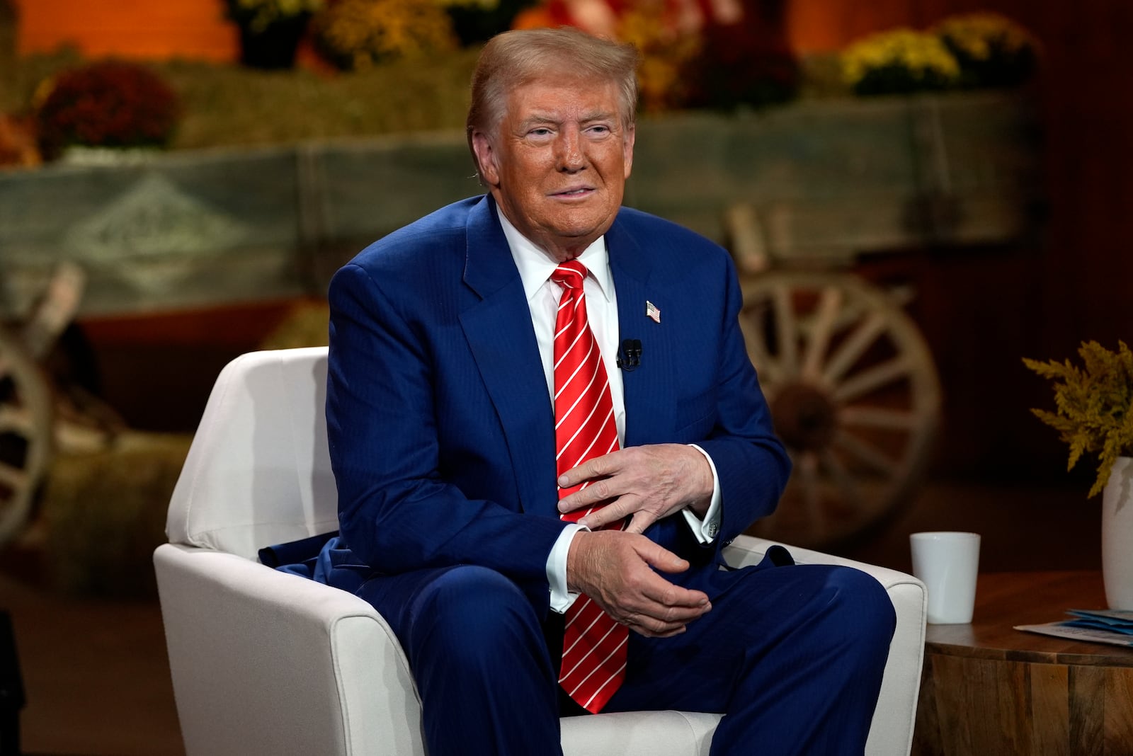 Republican presidential nominee former President Donald Trump listens during a break in a Fox News town hall with Harris Faulkner at The Reid Barn, Tuesday, Oct. 15, 2024, in Cumming, Ga. (AP Photo/Julia Demaree Nikhinson)