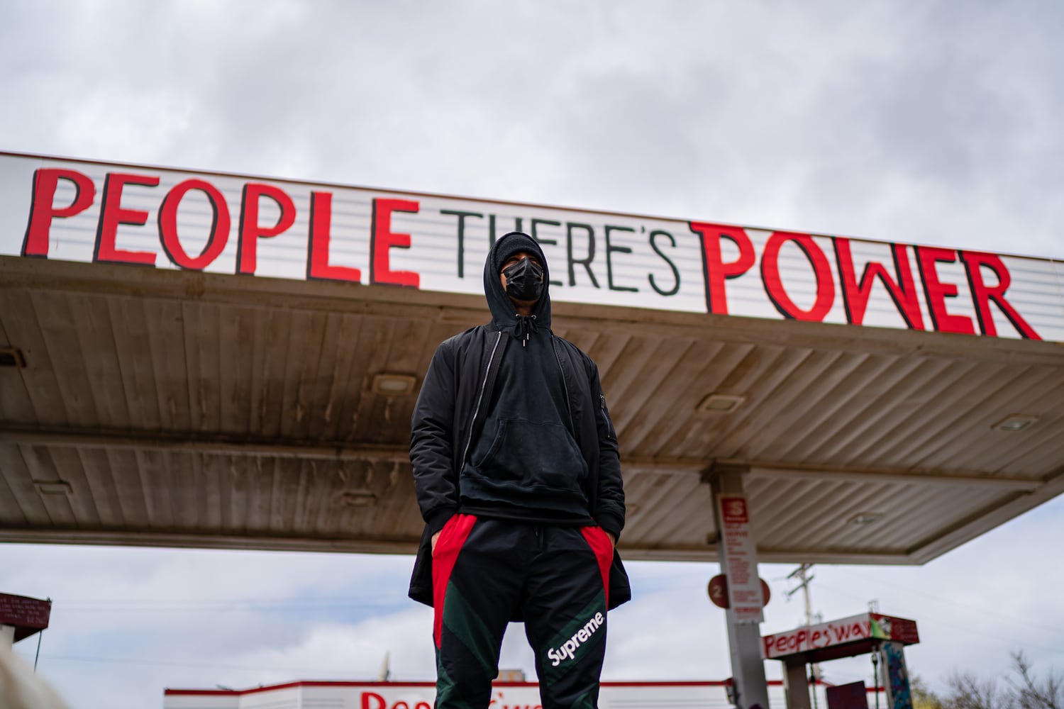 A man stands near the George Floyd memorial in Minneapolis on Tuesday, April 20, 2021, as the jury prepares to deliver verdicts in the Derek Chauvin trial.  (Amr Alfiky/The New York Times)