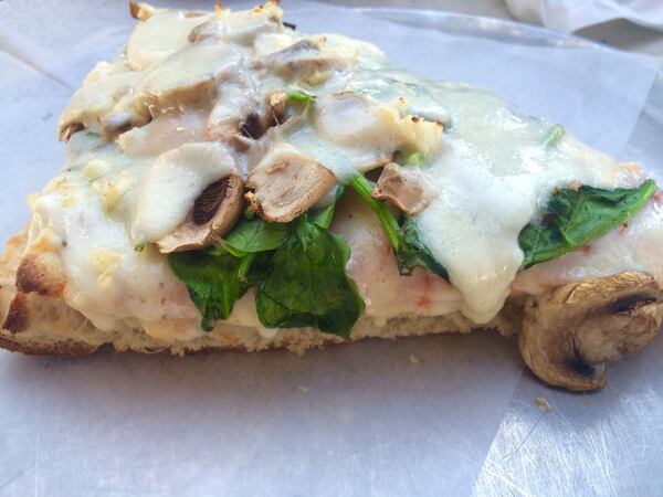 Fellini's offers a spinach-mushroom Sicilian-style pizza. Ligaya Figueras/ligaya.figueras@ajc.com